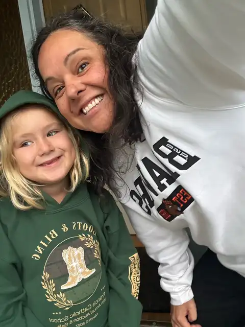Juni and her mom smiling together